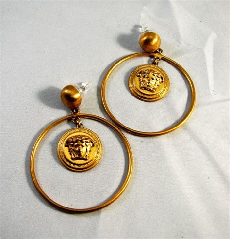 Versace: Gold Medusa Head Earrings 